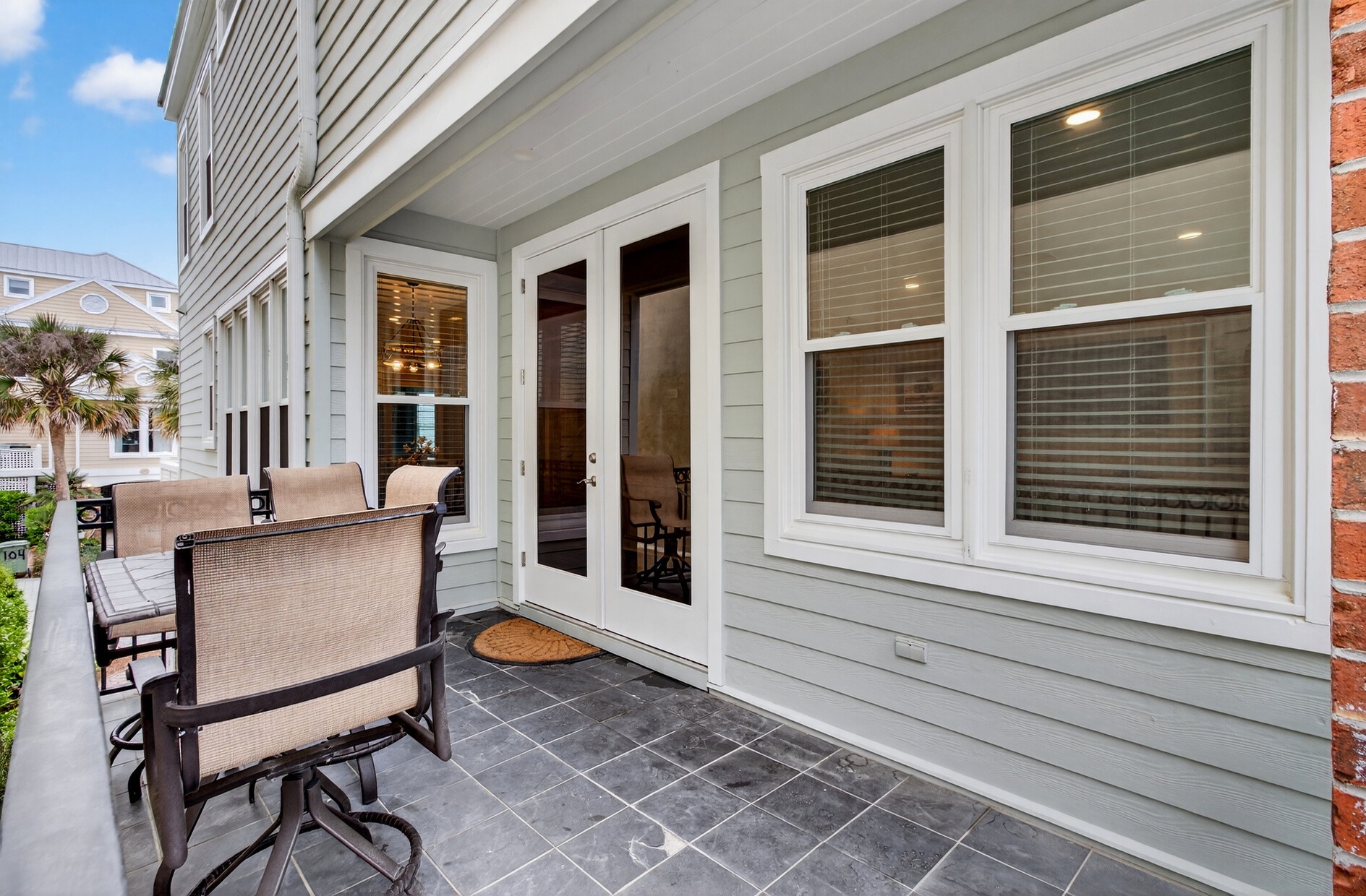 Unwind on your private balcony with comfortable seating, French doors opening to your bright interior.