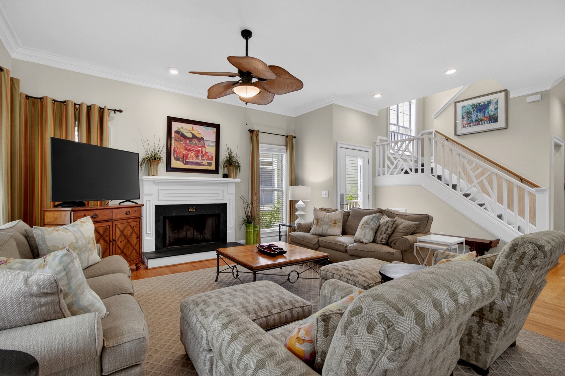 Gather with loved ones in this spacious living room, where vaulted ceilings and a cozy fireplace create the perfect setting for relaxing evenings together.