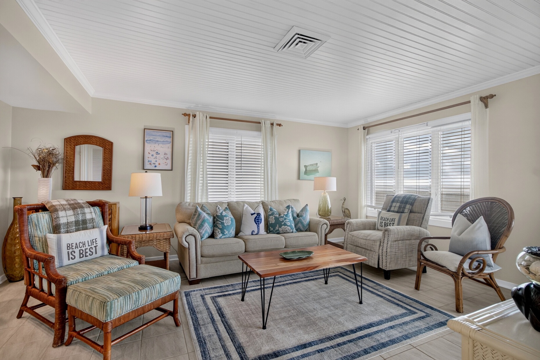 Settle into this welcoming coastal retreat where soft blue accents and beach-themed touches bring the ocean to your doorstep. Light-filled windows, comfortable seating, and thoughtful décor invite you to truly unwind.