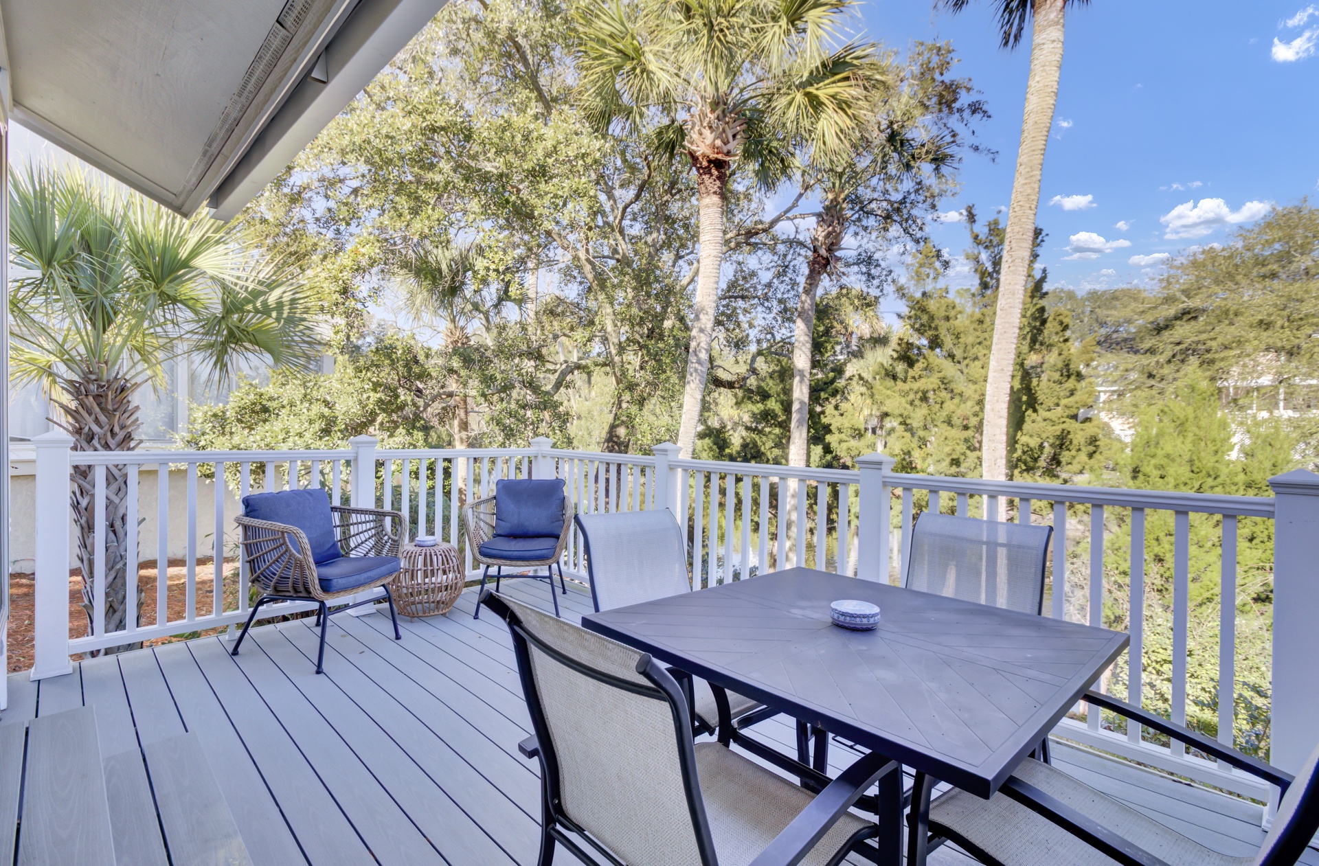 Relax on your private deck surrounded by swaying palms and lush greenery, where morning coffee and sunset dinners feel extra special.