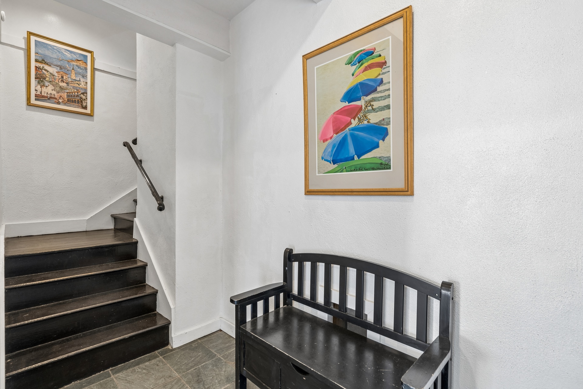 Discover charming coastal artwork and thoughtful touches in your stairway, featuring colorful beach umbrellas that capture the seaside spirit.
