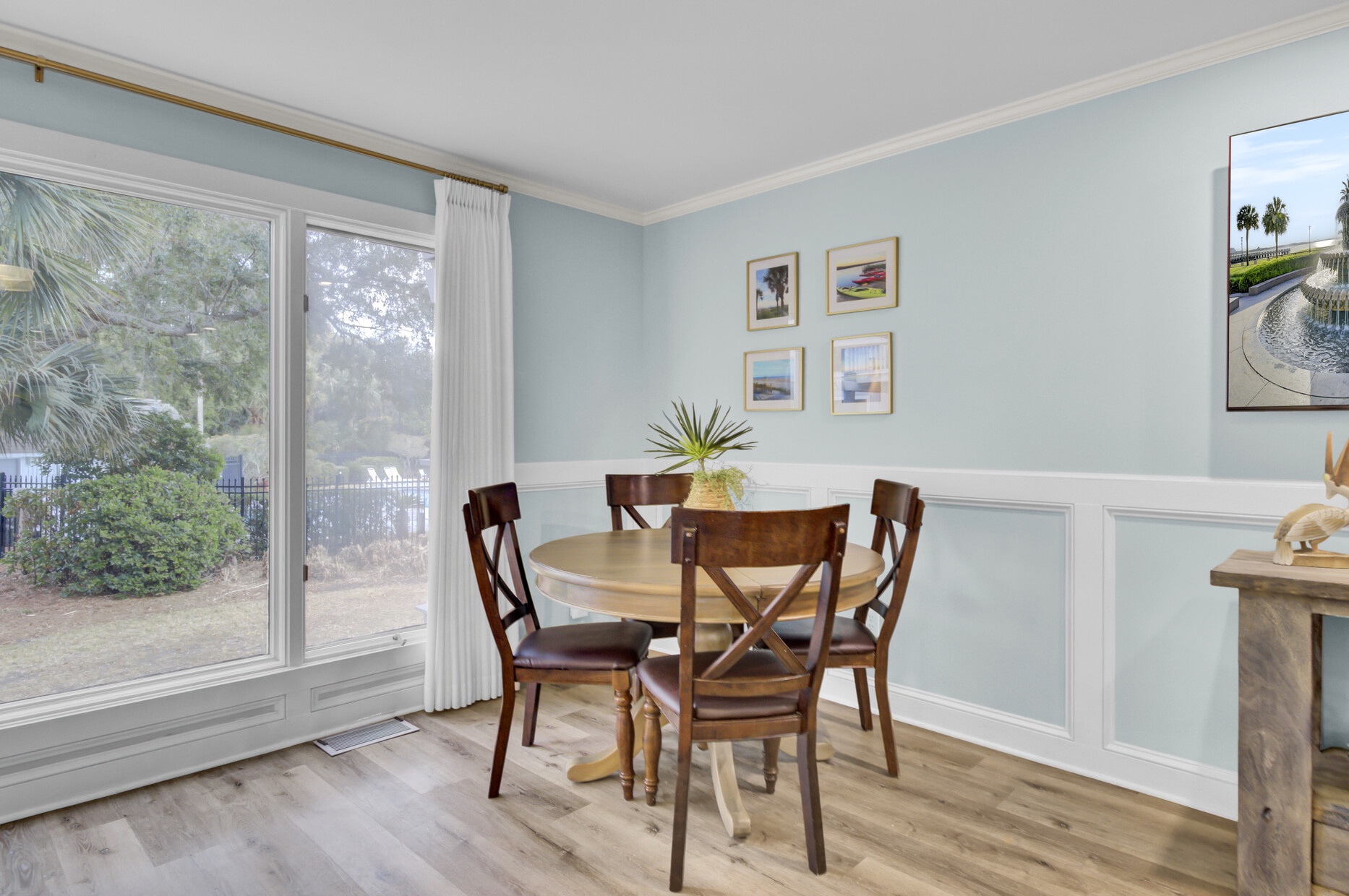 Enjoy meals in your bright dining nook with garden views and coastal-inspired decor that creates a peaceful breakfast spot.