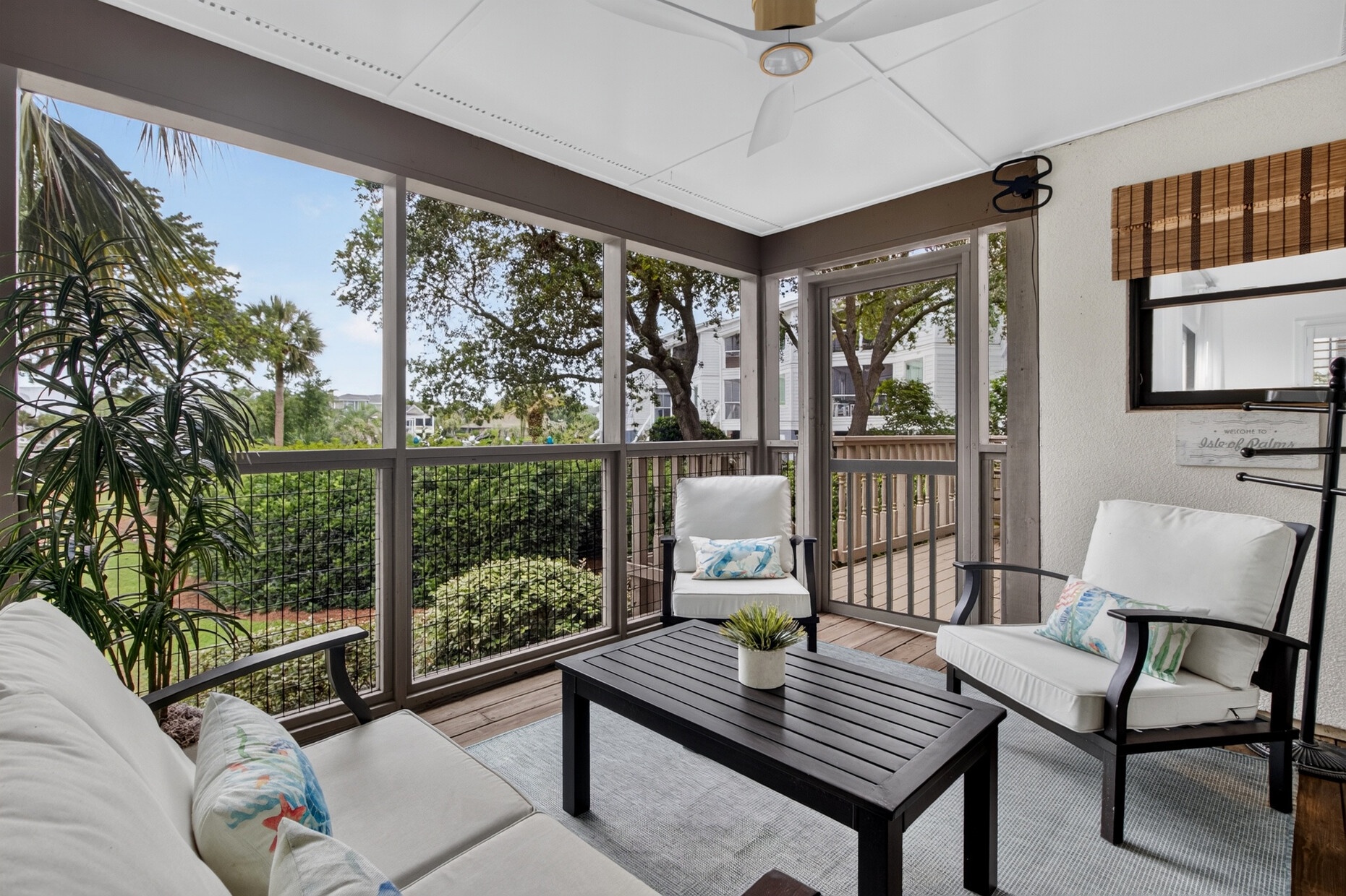 Picture yourself unwinding in this serene screened porch, where gentle breezes flow through and peaceful garden views invite you to relax. The perfect spot for your morning coffee or evening wind-down.