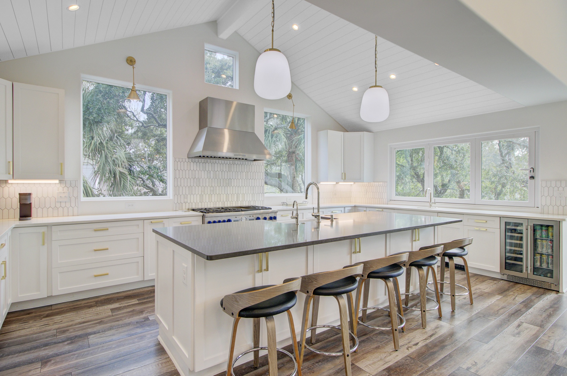 Your gourmet kitchen awaits with sleek countertops, modern appliances, and a spacious island perfect for cooking and gathering together.