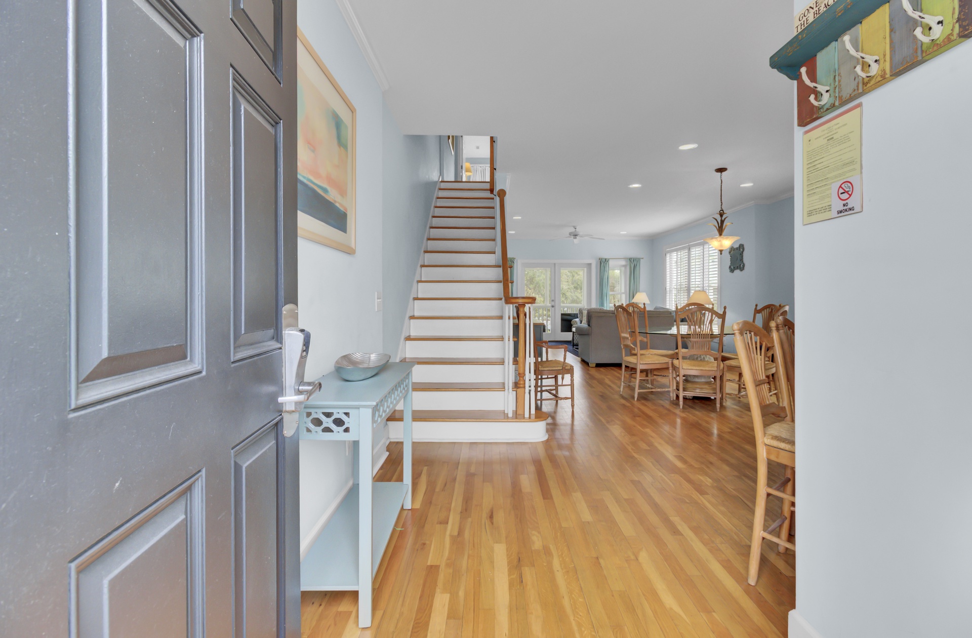 Step into your bright, open living space where gleaming hardwood floors flow seamlessly between dining and relaxation areas.