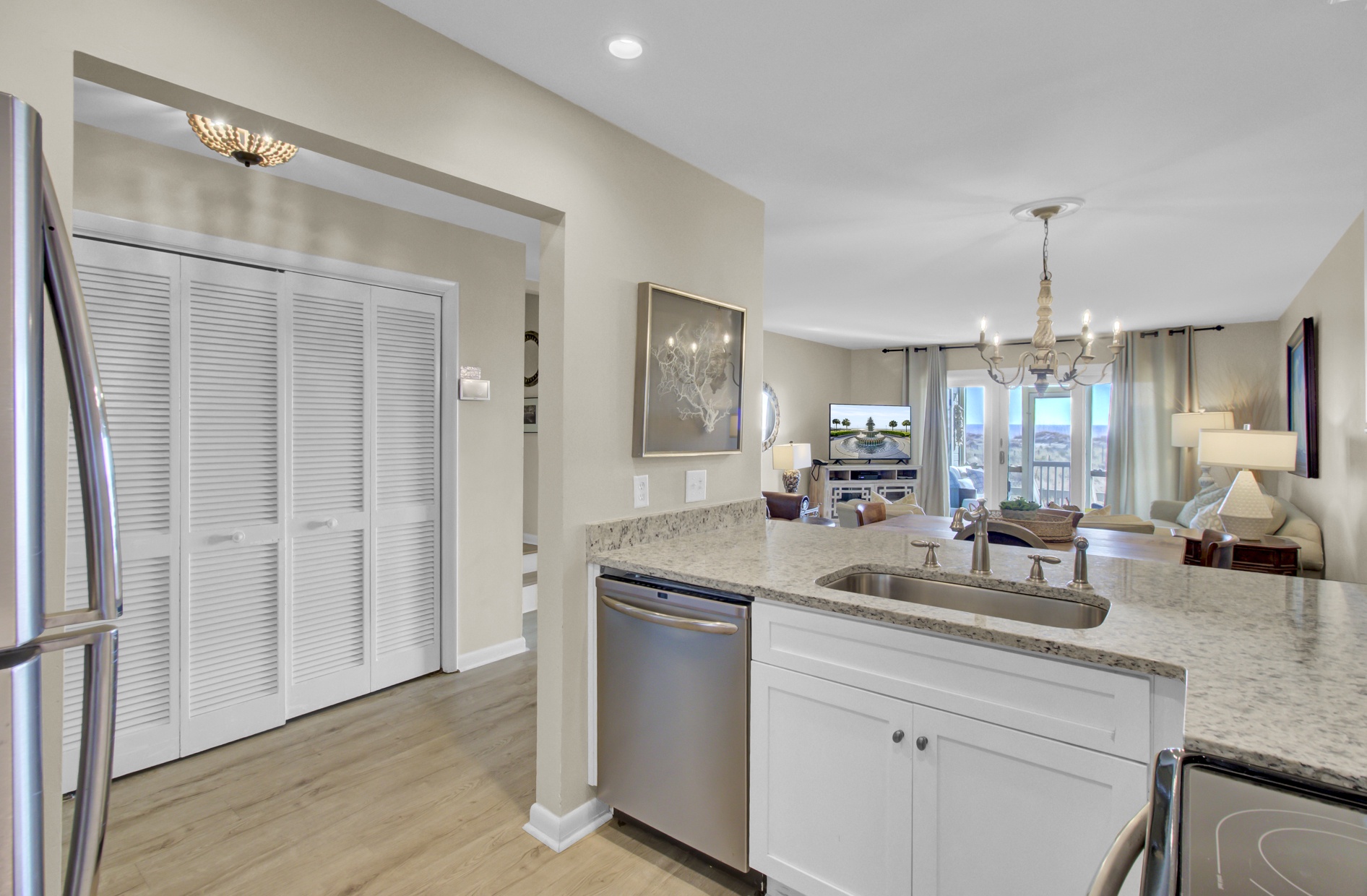 Your modern kitchen flows seamlessly into an elegant living space, featuring granite counters and stainless appliances for memorable meal preparation.