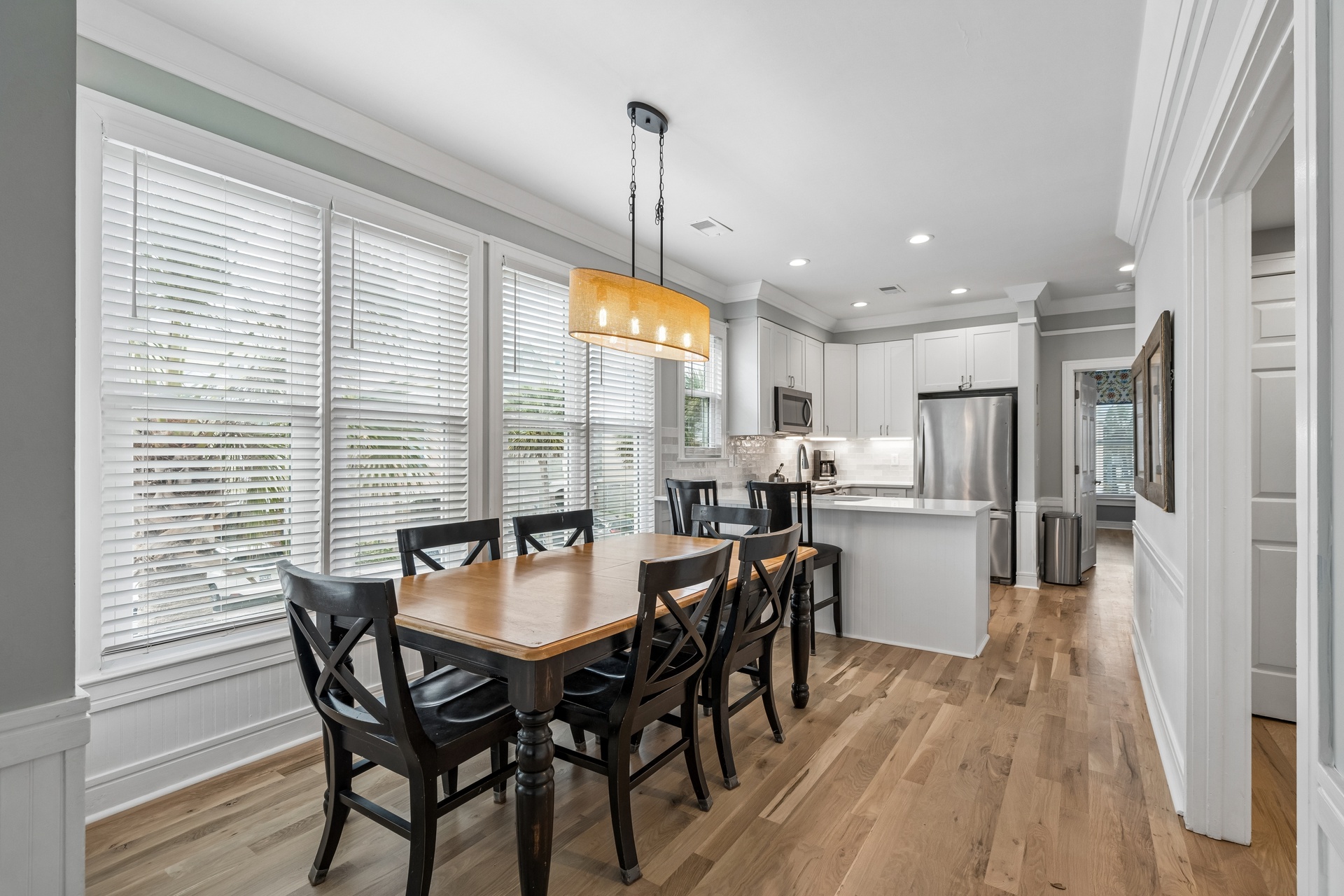 Your bright, open-concept dining and kitchen area features modern appliances and warm wood floors for memorable meal times.