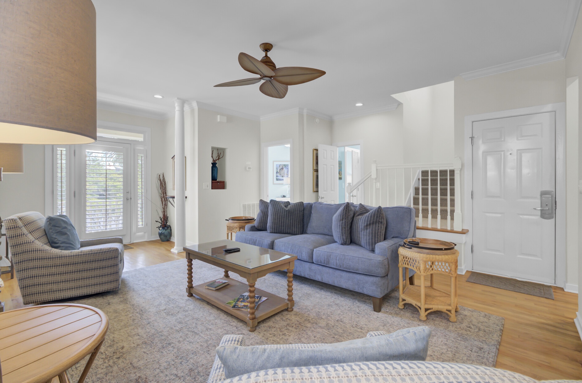 Relax in your bright, airy living space with soaring ceilings, comfy seating, and natural light streaming through.