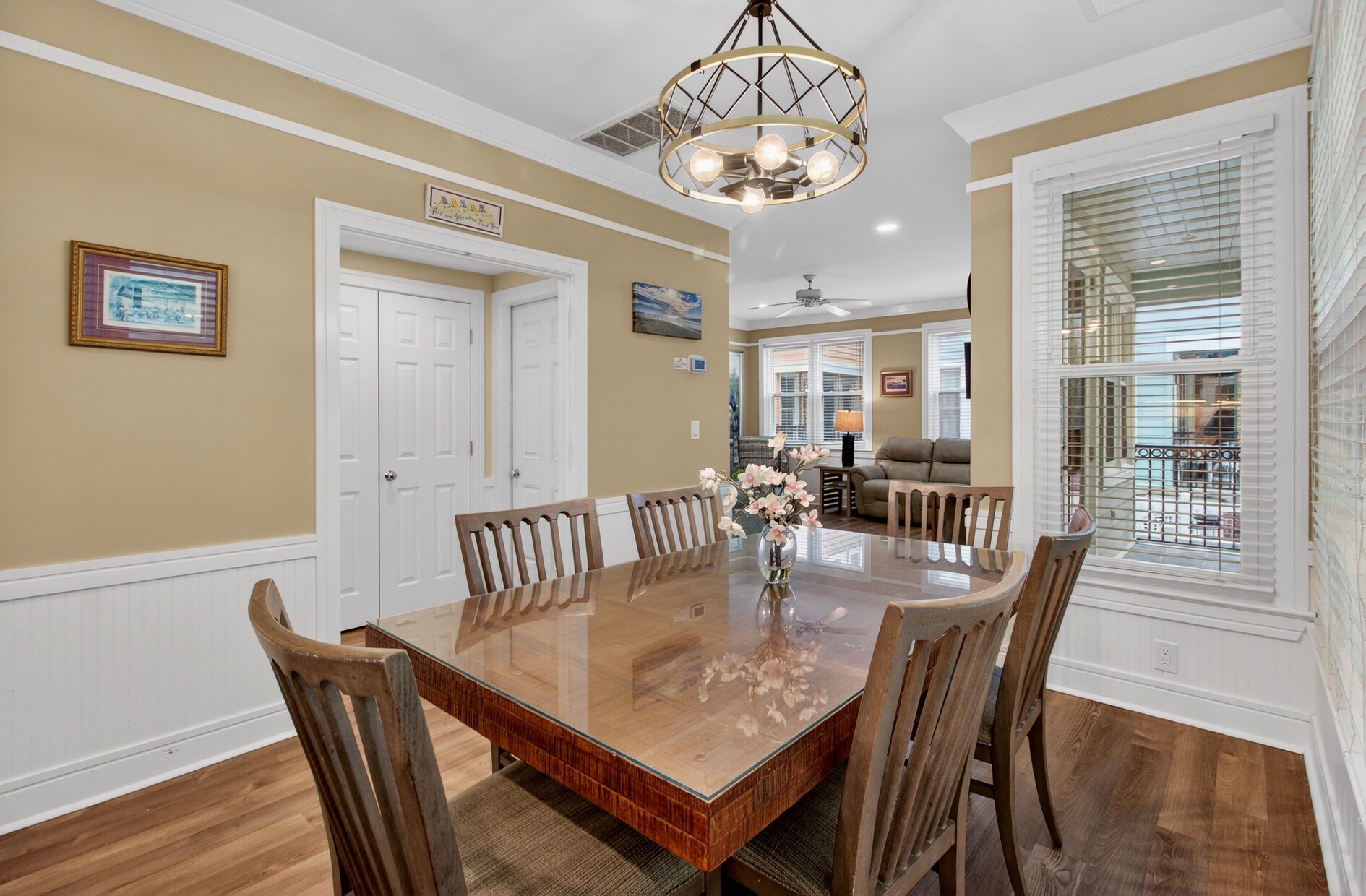 Gather around your elegant dining table for memorable meals under beautiful pendant lighting.
