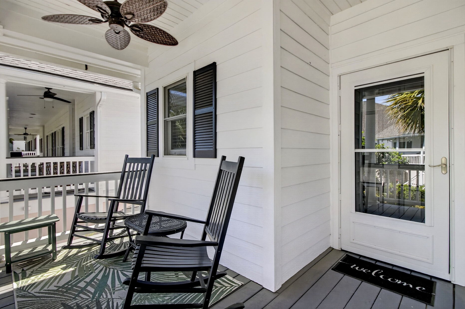 Settle into your private porch with rocking chairs and tropical breezes, where morning coffee tastes better under the ceiling fan.