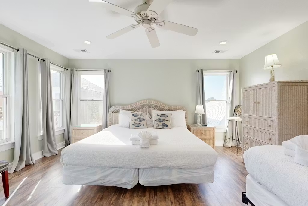 Drift into comfort in your spacious coastal bedroom, where crisp linens and natural textures create the perfect seaside sanctuary.