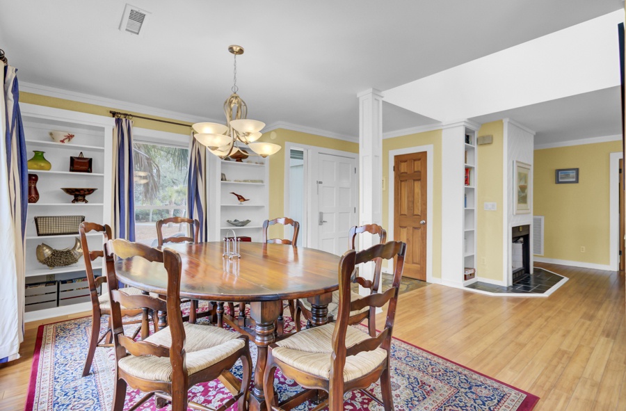Gather around this elegant dining table for memorable meals with loved ones in this warmly decorated space.