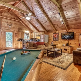 Cozy Bear Lodge's cozy living area with pool table