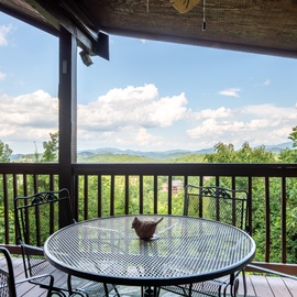 Sip your morning coffee at this mountain-view terrace, where rolling peaks and endless blue skies create a serene backdrop for relaxation.