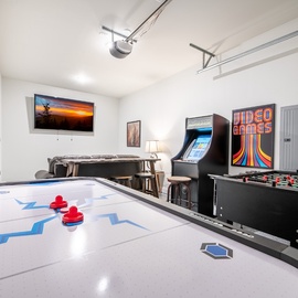 Your private game room awaits with air hockey, foosball, and classic arcade fun for endless entertainment.