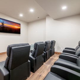 Sink into plush leather recliners in your private theater room, perfect for movie nights with friends and family.