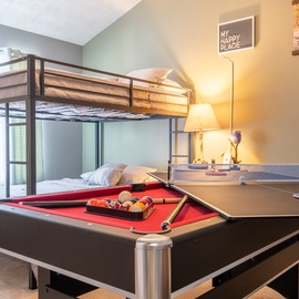 You and your family can unwind with fun game nights playing pool or ping pong, then retreat to comfortable bunk beds for a restful sleep in this bright, welcoming room.