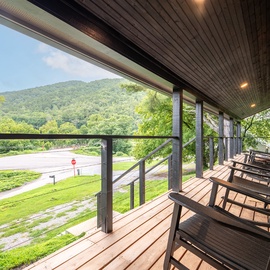 Settle into your rocking chair and soak in peaceful mountain views from this covered porch—your perfect spot for morning coffee or evening relaxation.