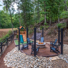 Dreamcatcher Lodge's fire pit and kids' play area