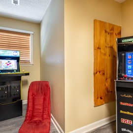 Relive your favorite childhood memories in this dedicated arcade room featuring two classic arcade cabinets, ready for friendly competition or solo gaming sessions whenever you need a fun break.