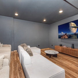 Your private entertainment retreat awaits with plush seating and a large projection screen. Dim the lights, settle in with friends, and immerse yourselves in movie magic.