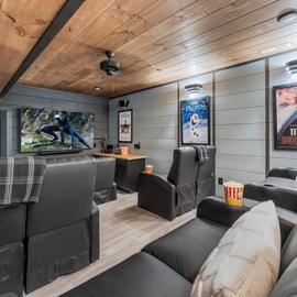Sink into plush theater seating and enjoy movie nights in your private cinema with surround sound and classic film posters.