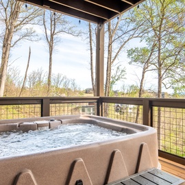 Soak in your private hot tub surrounded by lush forest views—the perfect spot to unwind and reconnect with nature.