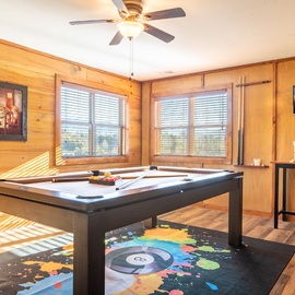 Challenge friends to pool in your private game room, warmed by golden sunlight and rustic charm.
