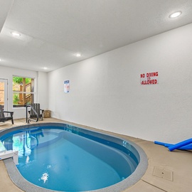 Dive into relaxation in your own private indoor pool, complete with lounge chairs and direct access to the sunny patio—perfect for year-round fun and unwinding.