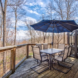 Step onto your private deck and breathe in the forest air while enjoying morning coffee at your outdoor dining table surrounded by nature.