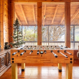 Mountain Memories 2's cozy living area foosball