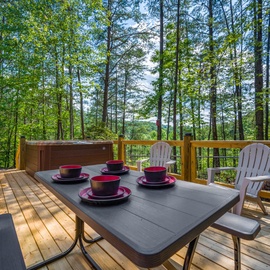 Enjoy morning coffee on your private forest deck, surrounded by towering trees and peaceful woodland views.