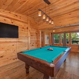 Challenge your group to a friendly billiards match while soaking in sweeping mountain vistas through the glass doors—entertainment and natural beauty perfectly combined.