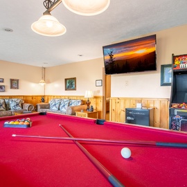 Challenge your friends to a game of pool or arcade classics in this inviting recreation room. Unwind on plush seating while your favorite shows play on the big screen TV.