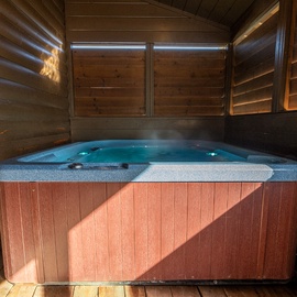 Cozy Bear Cove's bubbling hot tub