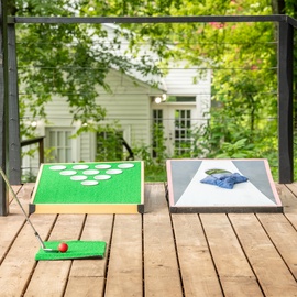 Challenge friends to a game of cornhole on your private deck, surrounded by lush trees and peaceful garden views. The outdoor space invites you to unwind with fun and fresh air.