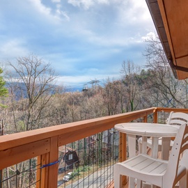 Sip your morning coffee while soaking in stunning mountain views from your private balcony, surrounded by peaceful forest canopy.
