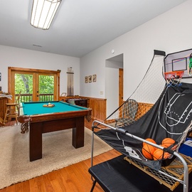 Challenge friends to pool or shoot some hoops in your private game room, complete with arcade basketball and natural light streaming through the windows.