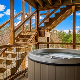 Soak your worries away in this private hot tub on your secluded deck, surrounded by peaceful forest views.