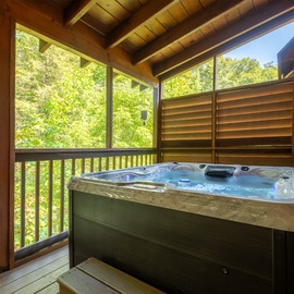 Slip into your private hot tub surrounded by lush forest views.