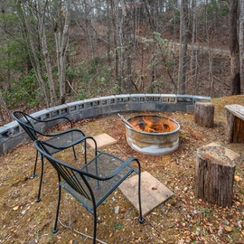 Gather around your private fire pit for cozy evenings, where crackling flames and rustic seating create perfect moments under the stars.