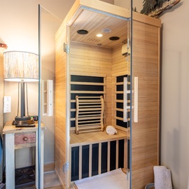 Unwind in your own private sauna after a long day exploring—just a few steps from your bed, this warm wood sanctuary invites you to relax and recharge.