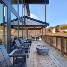 Your private deck invites relaxation with comfortable seating and a fire pit for memorable evenings under the open sky.