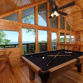 Chubby Bear's loft game room with pool table