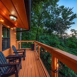 Unwind in your private deck chairs as twilight paints the sky and string lights cast a warm glow over the treetops. This peaceful retreat offers the perfect spot to sip morning coffee or enjoy evening conversations surrounded by nature.
