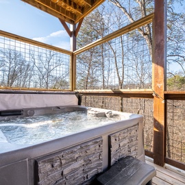 Soak your worries away in your private hot tub, surrounded by peaceful woodland views on your covered deck.