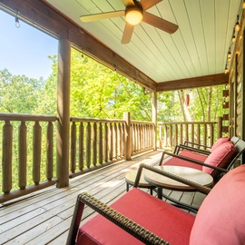 Unwind on your private covered deck, where sunlight filters through lush trees and a gentle breeze invites you to relax in your favorite chair with a good book and the sounds of nature.