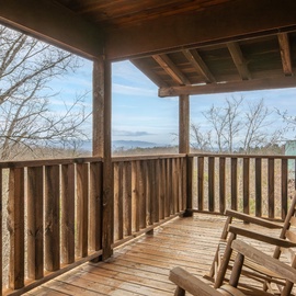 Settle into your private covered balcony and sway gently in rustic rocking chairs while taking in peaceful mountain vistas.