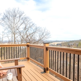 Sip your morning coffee on this private balcony while soaking in sweeping mountain views and peaceful countryside scenery.