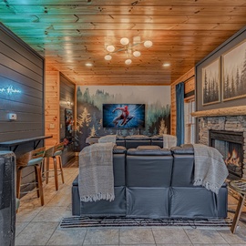 Cozy up in your mountain retreat with plush seating, crackling fireplace, and entertainment center